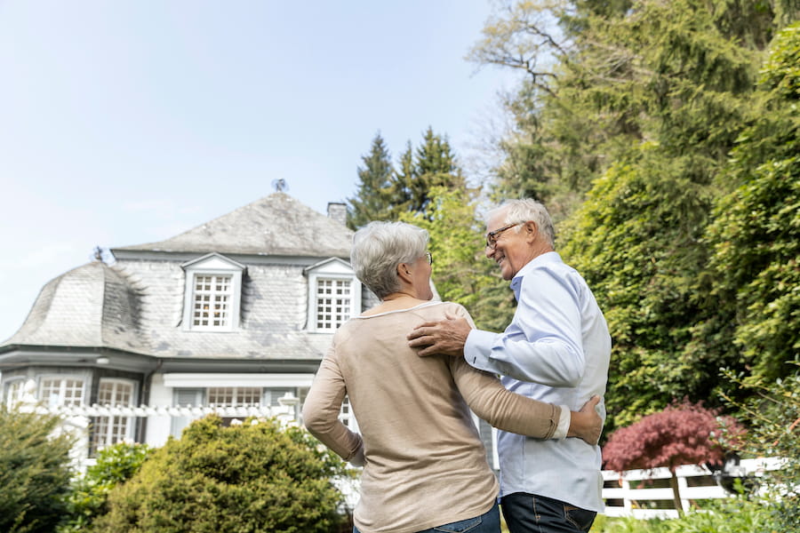 Senior couple comfortably living in a protected and well-maintained home