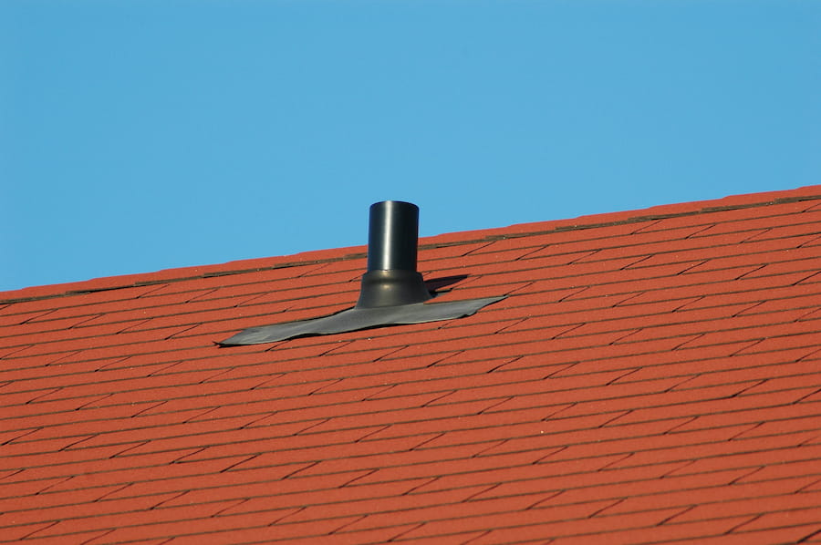 Rooftop Vent Shingles Against a Blue Sky