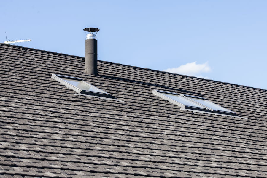 Roof with Chimney and Skylights on a Sunny Day