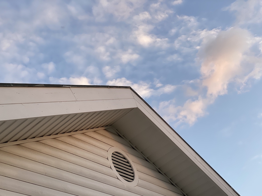 White House Facade Below Blue Sky With Clouds